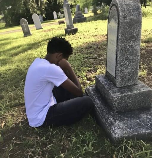 At His Adoptive Mother’s Grave, a Boy Discovers an Envelope with His Name